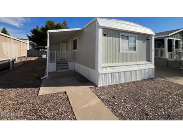 Charming single-story home featuring a covered porch and gravel landscaping at 535 S Alma School Rd # 37, Mesa, AZ 85210