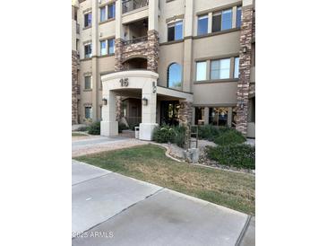 Elegant building entrance featuring stone accents and manicured landscaping, creating an inviting curb appeal at 5350 E Deer Valley Dr # 3267, Phoenix, AZ 85054