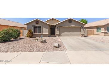 Charming single-Gathering home with desert landscaping and a two-car garage at 1564 E Leaf Rd, San Tan Valley, AZ 85140