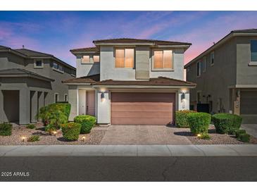 Charming two-story home boasting desert landscaping and a two-car garage at 22136 N 28Th Pl, Phoenix, AZ 85050