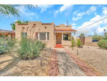 Charming single-story home featuring a well-maintained yard and inviting curb appeal at 2546 N 9Th St, Phoenix, AZ 85006