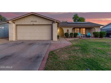 Charming single-Gathering home featuring a well-maintained lawn and a two-car garage at 5529 W Villa Maria Dr, Glendale, AZ 85308