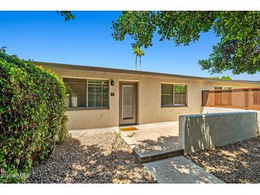A charming single-story home featuring a private entrance and well-maintained landscaping at 1850 E Maryland Ave # 18, Phoenix, AZ 85016