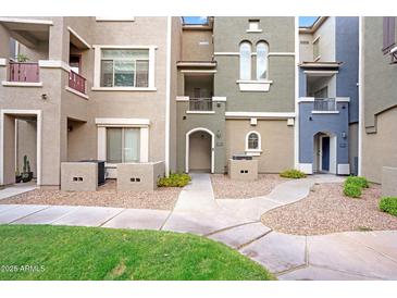 Attractive condominium exterior with varied neutral tones and well-maintained landscaping at 2401 E Rio Salado Pkwy # 1055, Tempe, AZ 85288