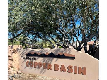 Attractive community entrance sign featuring the name 'Copper Basin' beneath a desert mountain silhouette at 4741 E Fire Opal Ln, San Tan Valley, AZ 85143