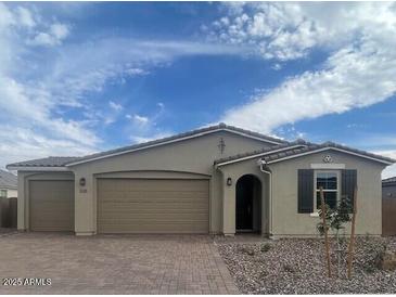 Charming single-story home with neutral stucco exterior and attached two-car garage at 12389 W Marguerite Ave, Avondale, AZ 85323