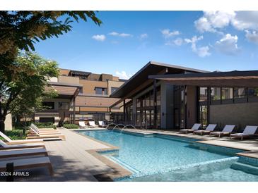 Resort-style pool with lounge chairs and modern architectural features at 19360 N 73Rd St # 1070, Scottsdale, AZ 85255