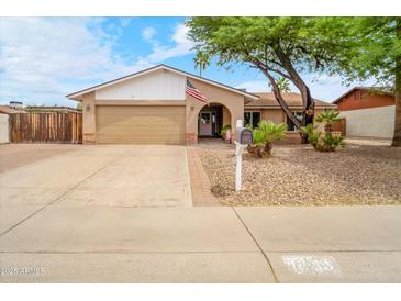 Charming single-story home with a well-maintained front yard and a spacious two-car garage at 3138 W Danbury Dr, Phoenix, AZ 85053