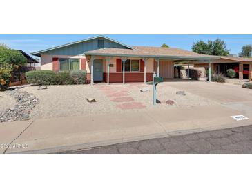 Charming single story home with well-maintained landscaping and gravel yard at 4418 W Palo Verde Ave, Glendale, AZ 85302