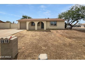 Charming single-story home with desert landscaping and arched entryways at 5918 S Parkside Dr, Tempe, AZ 85283
