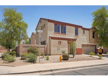 Two-story home featuring desert landscaping, a two-car garage, and an inviting exterior at 7501 S 14Th St, Phoenix, AZ 85042