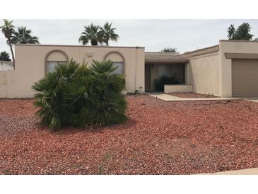 Charming single-story home with desert landscaping and attached two-car garage at 12832 N 29Th St, Phoenix, AZ 85032