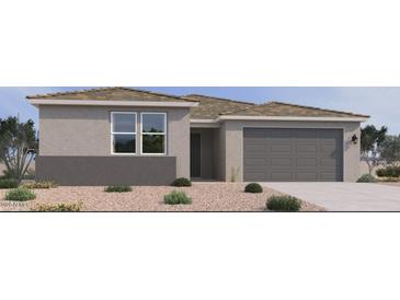 Charming single-story home with a two-car garage and low-maintenance desert landscaping at 15734 W Brown St, Waddell, AZ 85355
