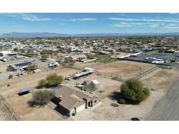 Expansive property featuring a residence with a large horse area and surrounding desert landscape under a blue sky at 3720 E Vista Grande --, San Tan Valley, AZ 85140