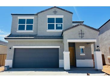 Charming two-story home featuring a gray exterior, a gray garage door, and a welcoming covered entry at 5053 E Umber Rd, San Tan Valley, AZ 85143