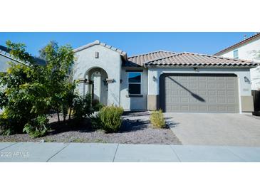 Charming single-story home featuring a tile roof, covered entry, and a well-maintained desert landscaped front yard at 15424 N 22Nd Ln, Phoenix, AZ 85023