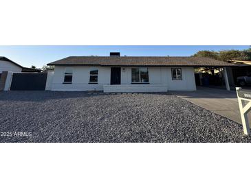 Charming single-story home with a freshly painted exterior and minimalist landscaping at 1720 W Michigan Ave, Phoenix, AZ 85023