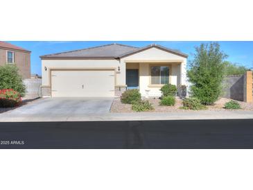Charming single-story home featuring a two-car garage and well-maintained landscaping at 19365 N Pietra Dr, Maricopa, AZ 85138