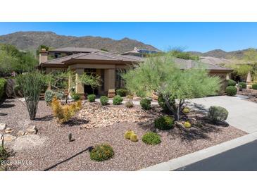 Beautiful single-story home featuring desert landscaping with mountain views at 1958 W Legends Way, Anthem, AZ 85086
