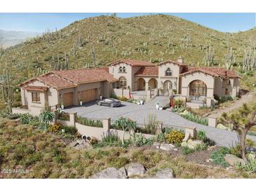 Stunning desert home featuring a tile roof, grand entrance, and beautifully landscaped surroundings at 3284 W Highlands Dr, Buckeye, AZ 85396