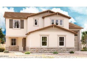 Charming two-story home with stone accents, complemented by a well-maintained front yard at 21654 E Saddle Way, Queen Creek, AZ 85142