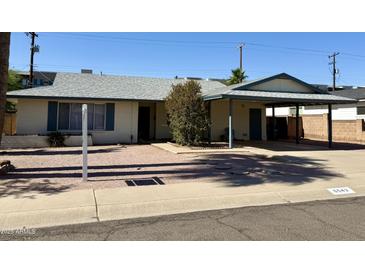 Charming single story home with desert landscaping, covered parking, and updated features at 6543 E Palm Ln, Scottsdale, AZ 85257