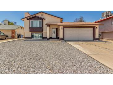 Charming two-story home featuring a two-car garage and low-maintenance gravel landscaping at 8829 W Sheridan St, Phoenix, AZ 85037