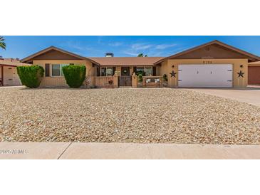 Inviting single-Gathering home with a desert landscaped front yard and a charming courtyard entrance at 4145 W Hayward Ave, Phoenix, AZ 85051
