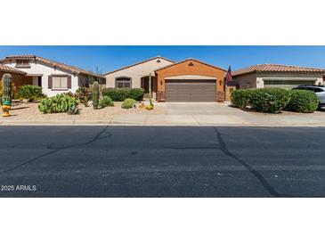 Charming home with desert landscaping, a two-car garage, and classic Southwestern architecture at 47719 N Camino Del Sol --, Gold Canyon, AZ 85118
