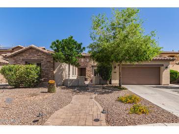 Charming single-Gathering home featuring a stone facade, manicured landscaping and a brick pathway at 850 W Folley St, Chandler, AZ 85225