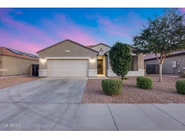Charming single-story home featuring a spacious garage and low-maintenance landscaping at 13657 W Paso Trl, Peoria, AZ 85383