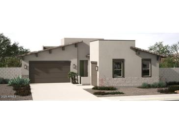 Charming single-story home featuring a neutral color palette, low maintenance landscaping, and an attached two car garage at 18069 W Larkspur Dr, Goodyear, AZ 85338