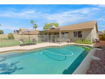 Sparkling pool with a well-maintained backyard, perfect for outdoor enjoyment and relaxation at 4213 W Calle Lejos --, Glendale, AZ 85310