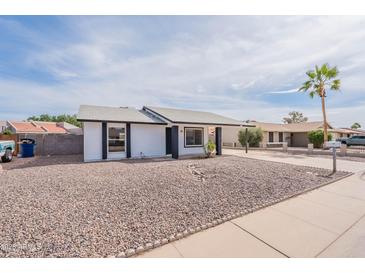 Charming single-story home featuring a low maintenance desert landscaped front yard at 733 W El Prado Rd, Chandler, AZ 85225