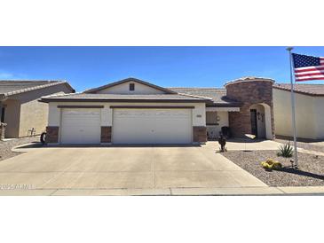 Charming home featuring a spacious two-car garage, desert landscaping, and an inviting entrance at 2101 S Meridian Rd # 199, Apache Junction, AZ 85120
