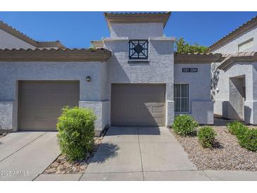 Charming home featuring a two-car garage and well-maintained landscaping in a lovely community at 3236 E Chandler Blvd # 2003, Phoenix, AZ 85048