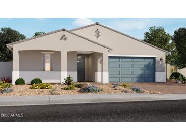 Charming single-story home with a two-car garage and a landscaped front yard featuring desert plants at 17670 W Mariposa Dr, Goodyear, AZ 85395