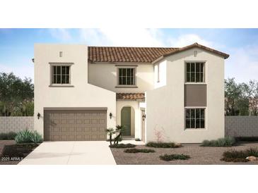 Charming two-story home featuring a light neutral color scheme, tile roof, and an attached garage with a stone pathway at 18060 W Larkspur Dr, Goodyear, AZ 85338