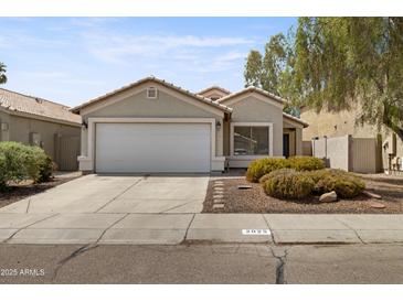 Charming single-story home featuring a two-car garage and low maintenance desert landscaping at 2625 E Beverly Rd, Phoenix, AZ 85042