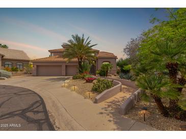 Elegant home featuring a tile roof, manicured landscaping, and a private entry walkway, perfect for curb appeal at 3514 E Desert Broom E Way, Phoenix, AZ 85044
