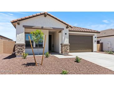 Charming single-Gathering home featuring a tile roof and a two-car garage at 3913 S 233Rd Ln, Buckeye, AZ 85326