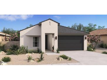 Beautiful single-story home featuring a modern design and a low-maintenance desert landscape at 3913 S 233Rd Ln, Buckeye, AZ 85326