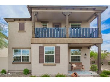 Charming two-story home showcasing a cozy front porch and well-maintained landscaping at 29491 N 122Nd Gln, Peoria, AZ 85383