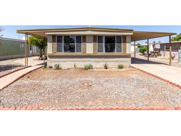 Charming mobile home with mature landscaping and covered parking at 2650 W Union Hills Dr # 98, Phoenix, AZ 85027