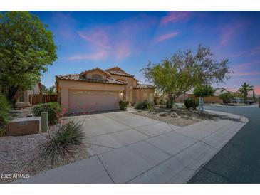 Charming single-story home with a desert-landscaped front yard, spacious driveway, and a two-car garage at 7307 E Black Rock Rd, Scottsdale, AZ 85255