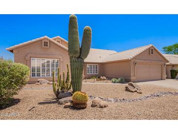 Charming home featuring desert landscaping and beautiful large cactus at 30645 N 44Th St, Cave Creek, AZ 85331