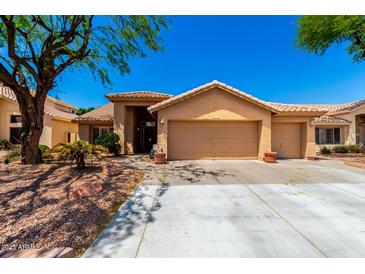 Charming home with a well-manicured front yard and a spacious three-car garage at 5912 W Gail Dr, Chandler, AZ 85226