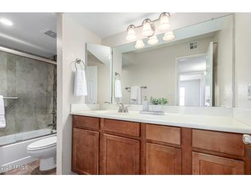 Bathroom featuring a large mirror, well-lit vanity, and combined shower-tub at 8787 E Mountain View Rd # 1087, Scottsdale, AZ 85258