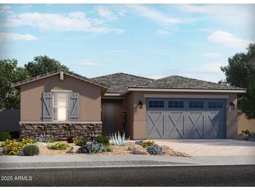 Charming single-story home with a neutral color scheme, gray shutters, and an attached two-car garage at 24478 W Grenadine Rd, Buckeye, AZ 85326