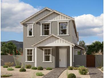 Charming two-story home featuring gray stucco, complemented by a well-manicured front yard and inviting entryway at 26209 N 19Th Ln, Phoenix, AZ 85085